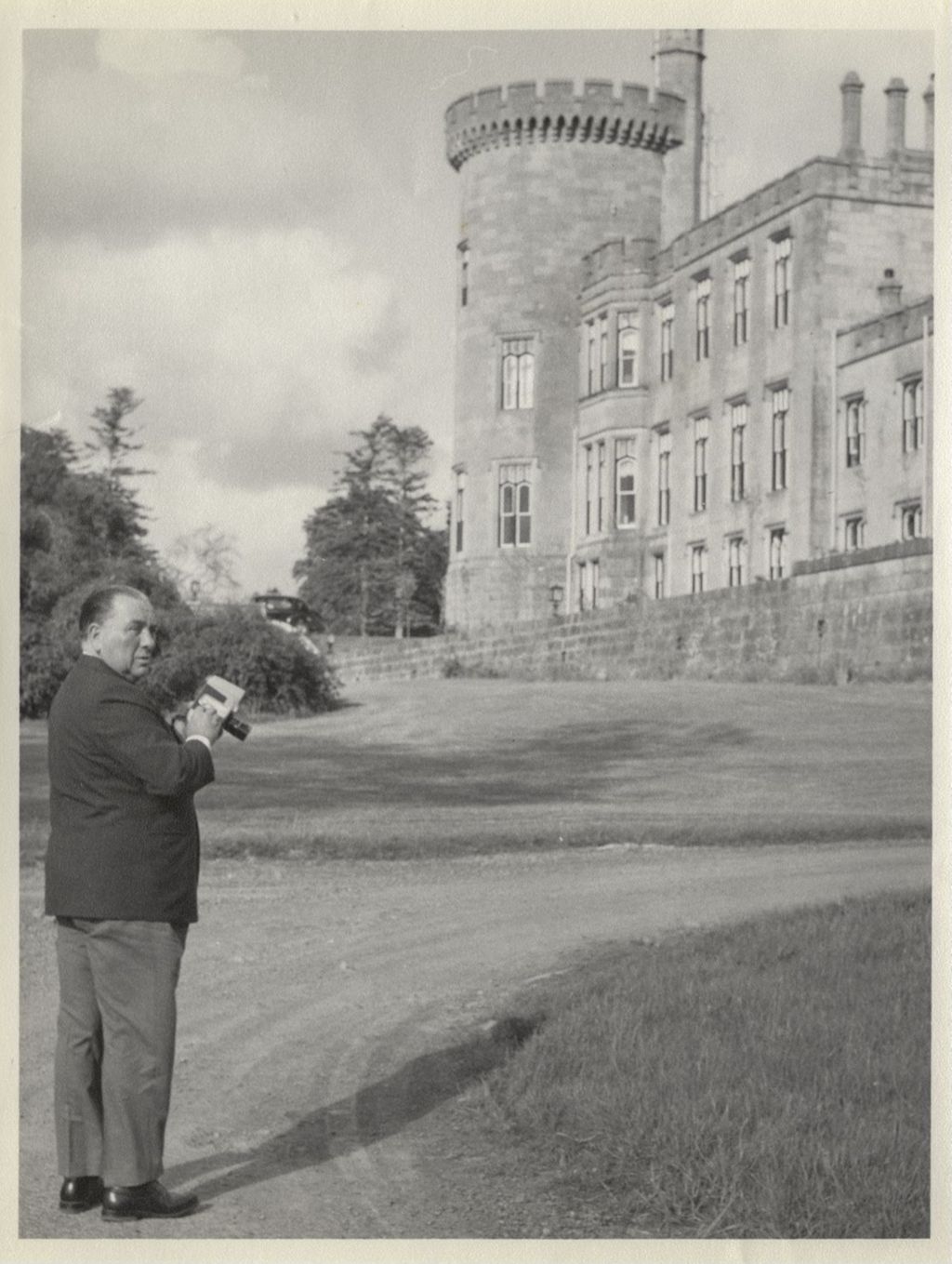 Trip to Ireland, Richard J. Daley with a camera outside a castle