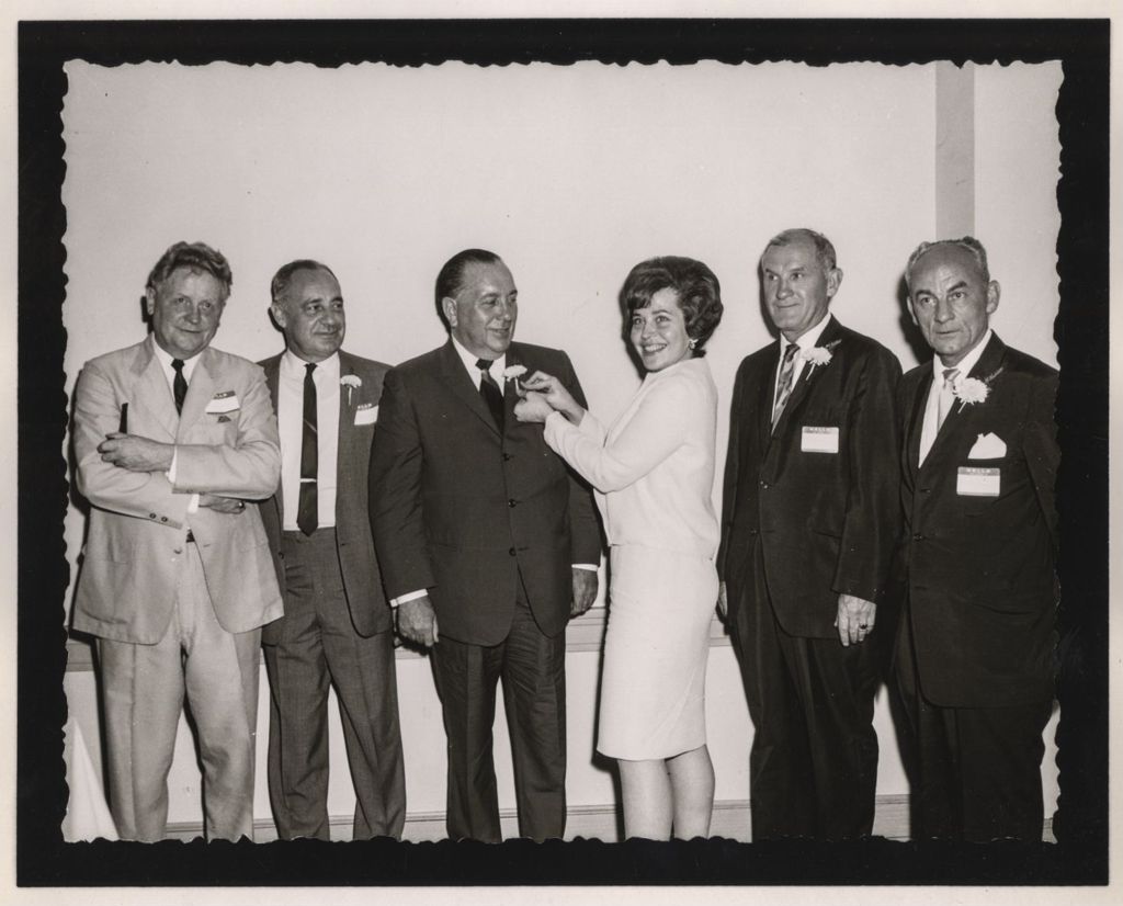 Friendship Banquet photo album, Richard J. Daley receives a corsage