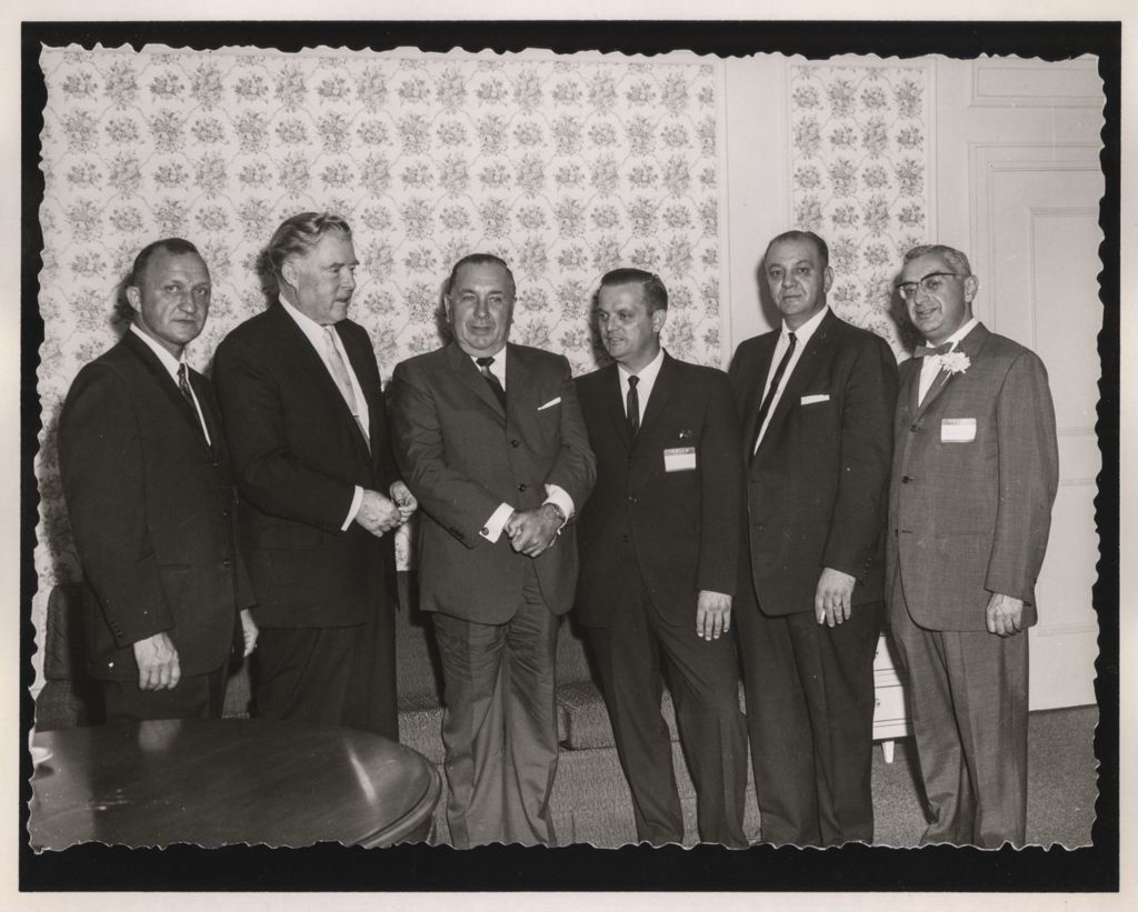 Friendship Banquet photo album, Richard J. Daley with a group of men