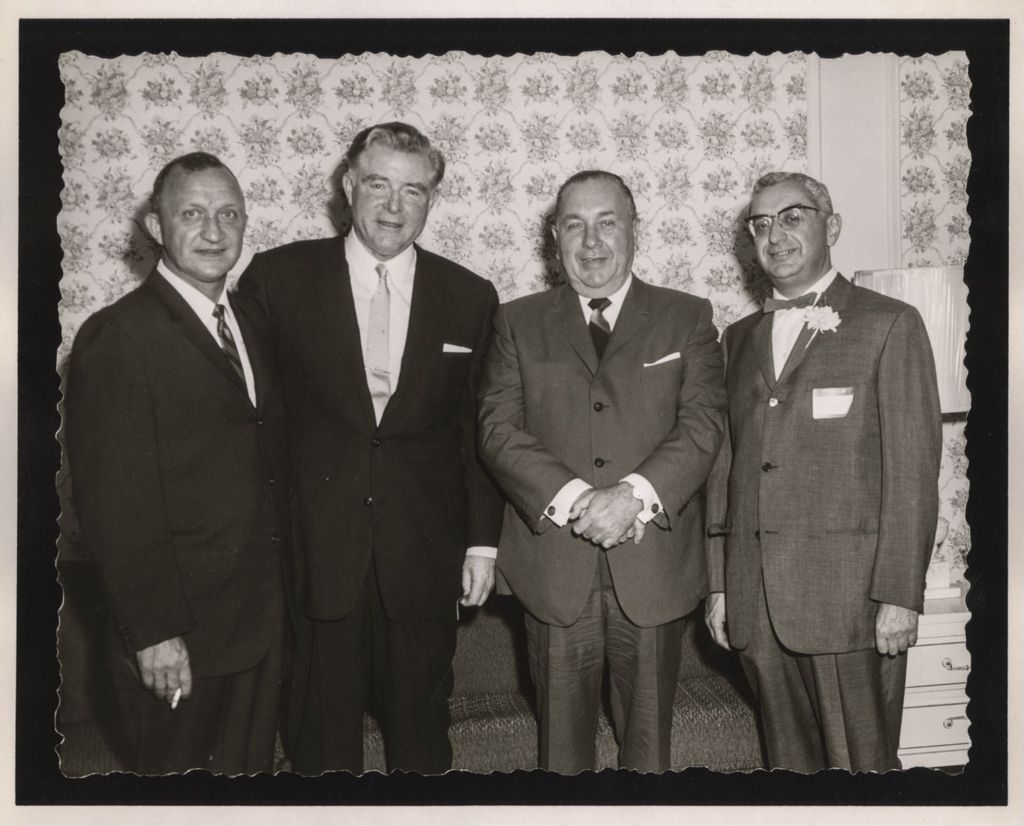 Friendship Banquet photo album, Richard J. Daley with a group of men