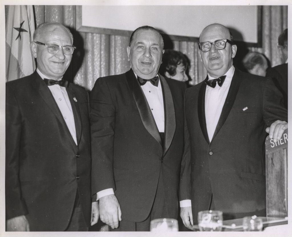 Miniature of Richard J. Daley with two men at an event