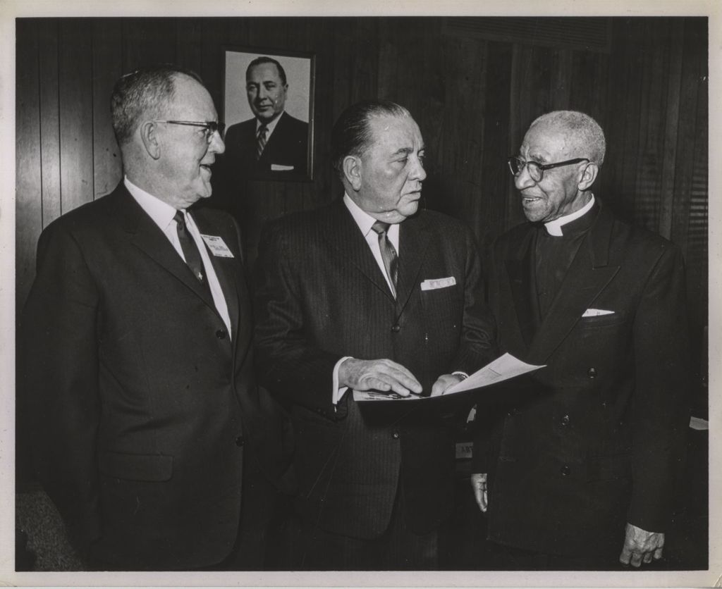 Richard J. Daley with a clergyman and another man