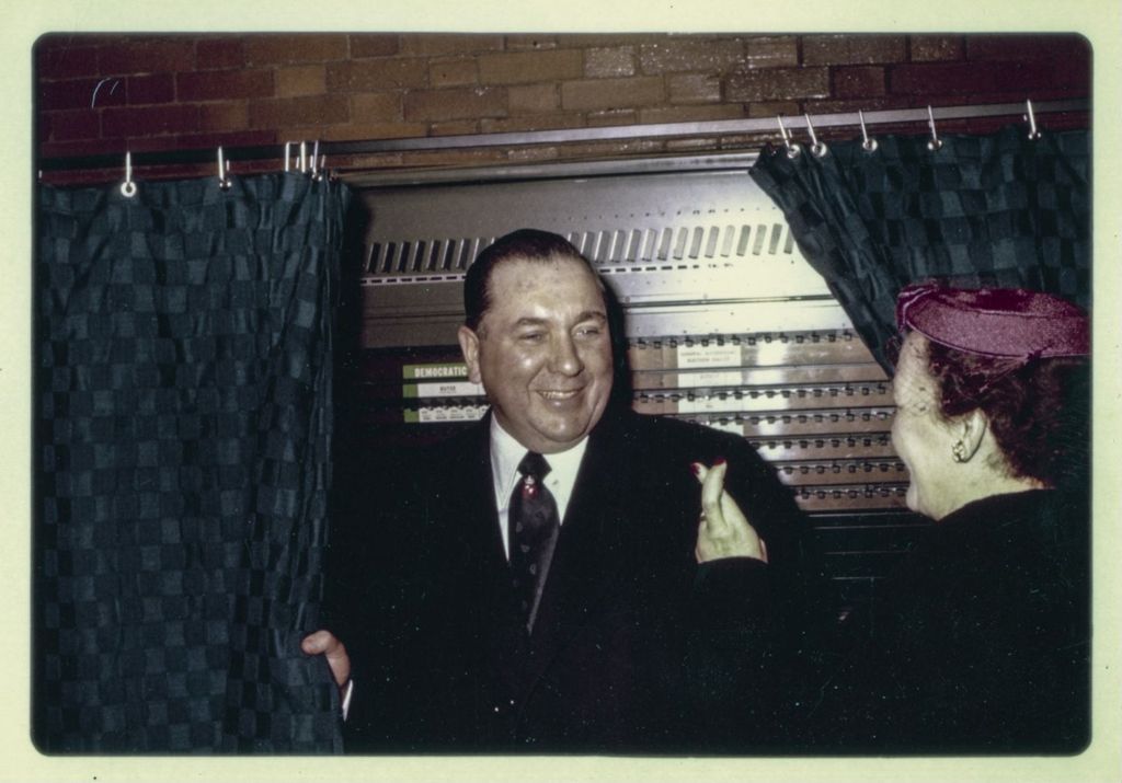 Primary election day, Richard J. Daley and Eleanor Daley at a voting booth