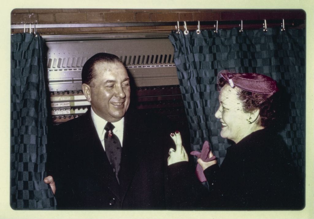 Primary election day, Richard J. Daley and Eleanor Daley at a voting booth