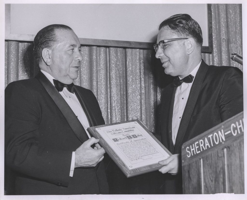 Miniature of Richard J. Daley accepting plaque from the Hellenic American Citizens Committee