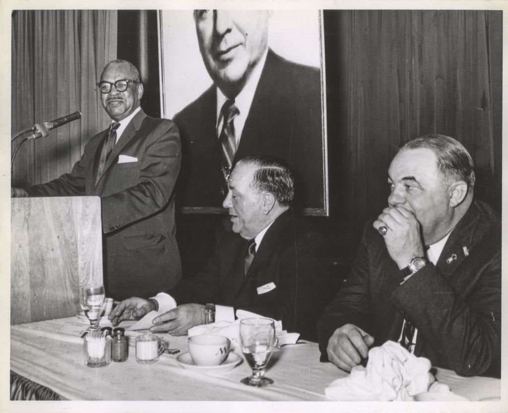 Miniature of William Dawson speaking, Richard J. Daley and Bill Milota listening
