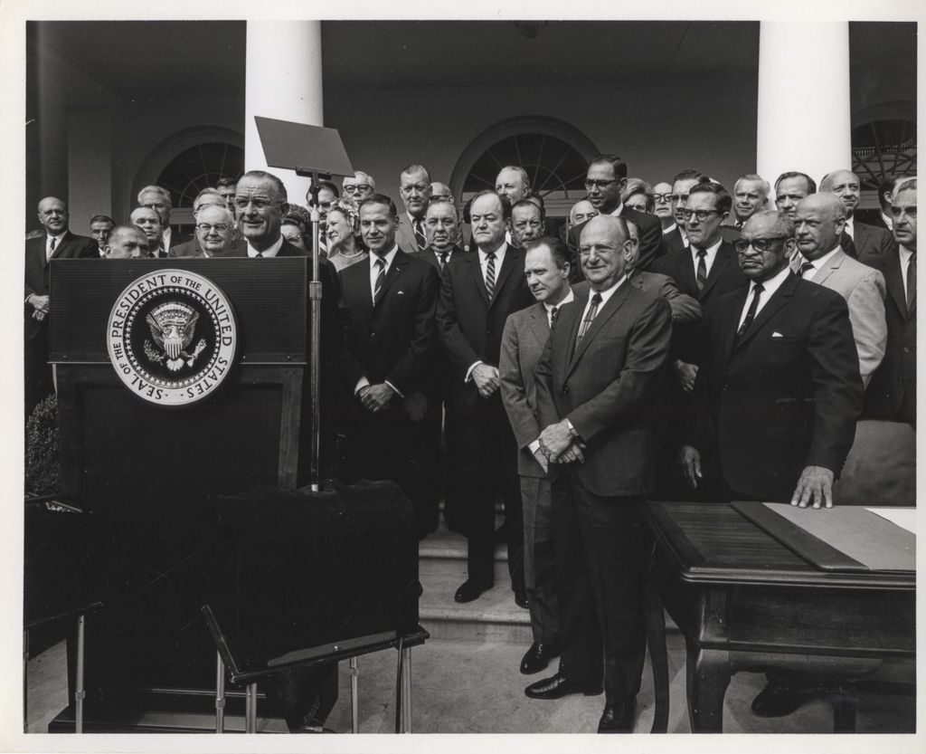 Miniature of President Lyndon B. Johnson speaking outside the White House