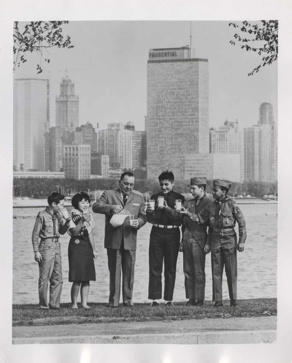 Richard J. Daley pouring milk with Scouts on lakefront