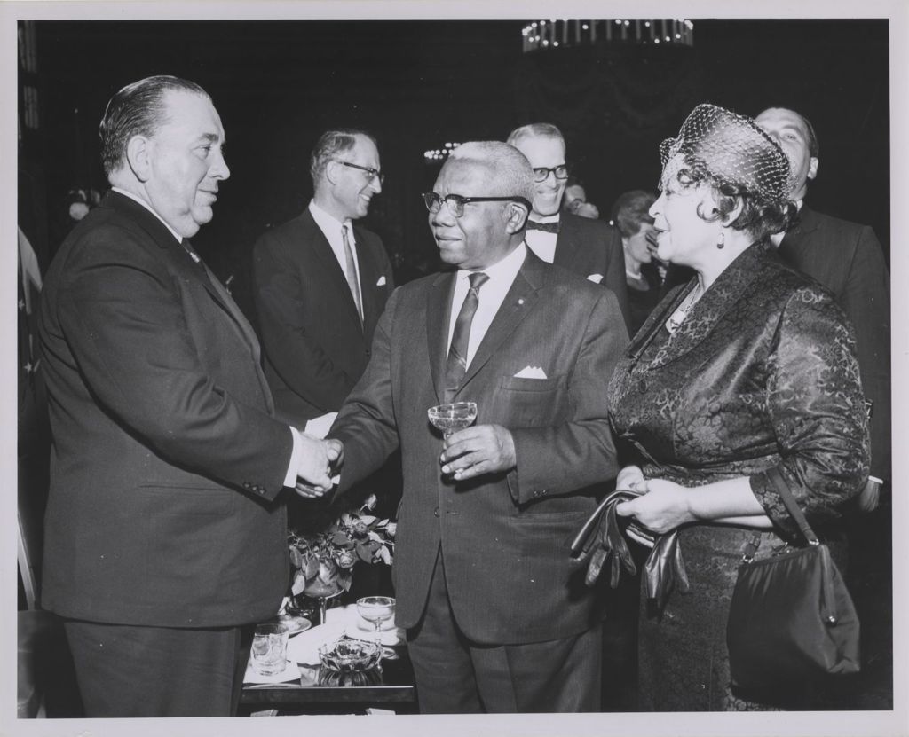Consular Corps Reception, Richard J. Daley shakes hands with a man from Liberia