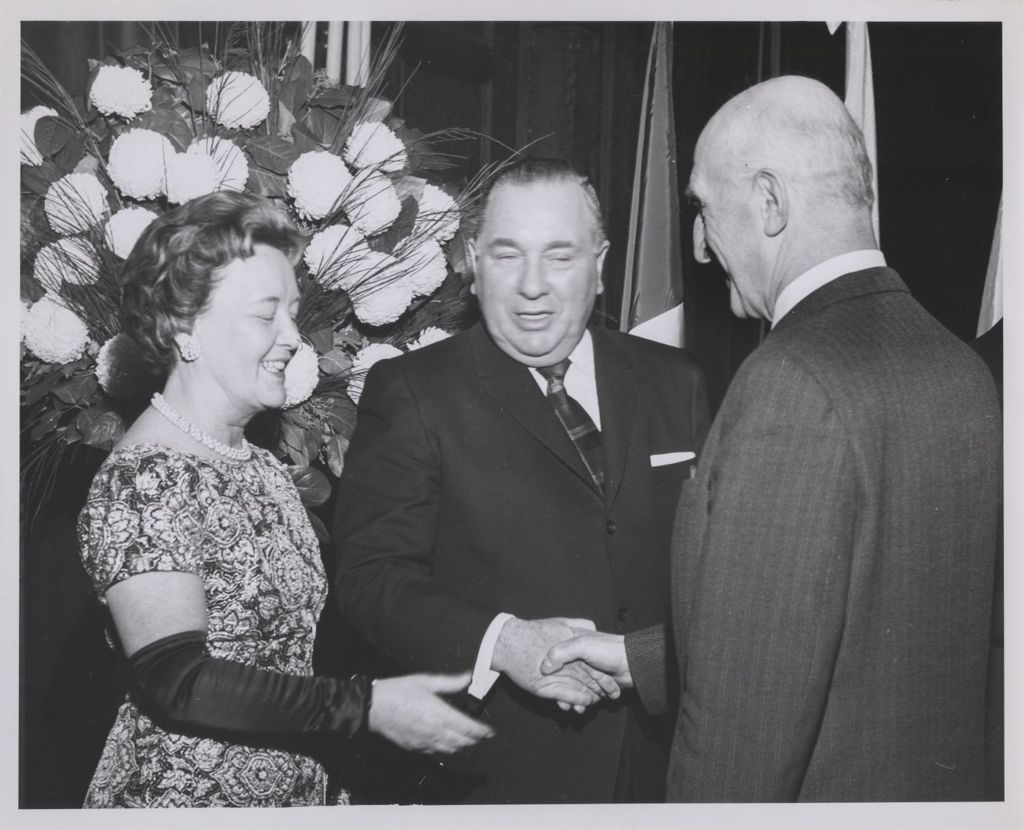Consular Corps Reception, Richard J. and Eleanor Daley shake hands with a man