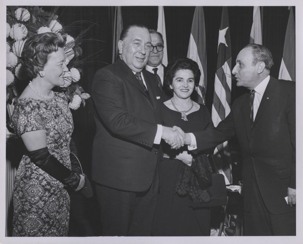Consular Corps Reception, Richard J. Daley shakes hands with a man