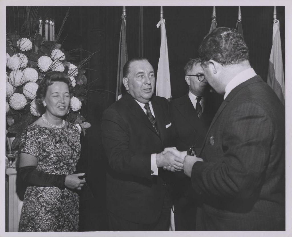 Consular Corps Reception, Richard J. and Eleanor Daley greet a man