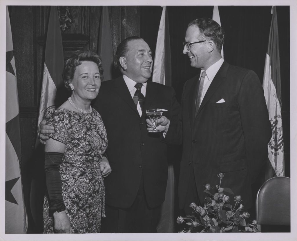 Consular Corps Reception, Richard J. and Eleanor Daley with a man holding a cocktail