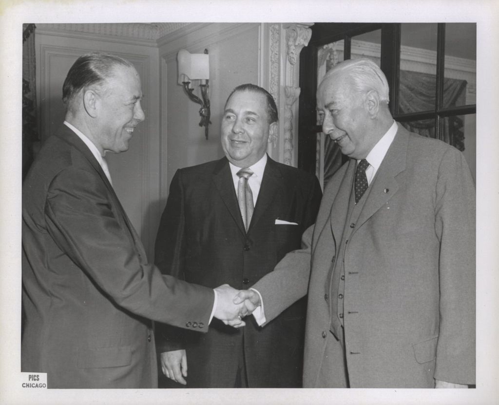Miniature of Richard J. Daley with two men shaking hands