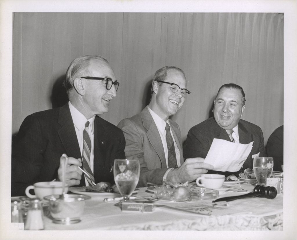 Richard J. Daley and two others at a banquet
