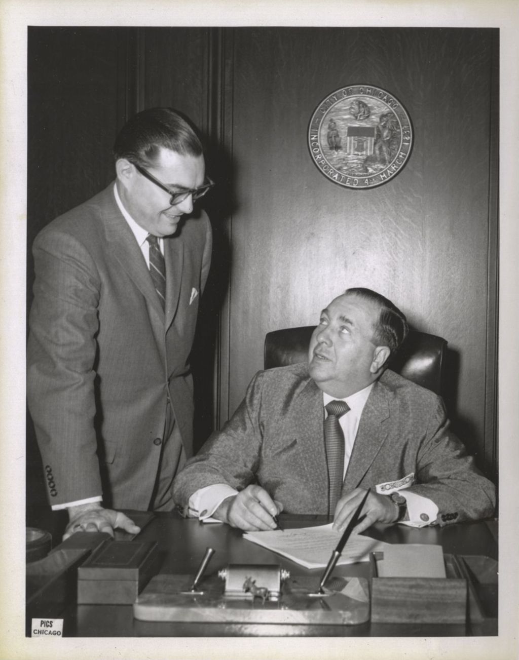 Sheriff Joseph Lohman (?) with Richard J. Daley at his desk