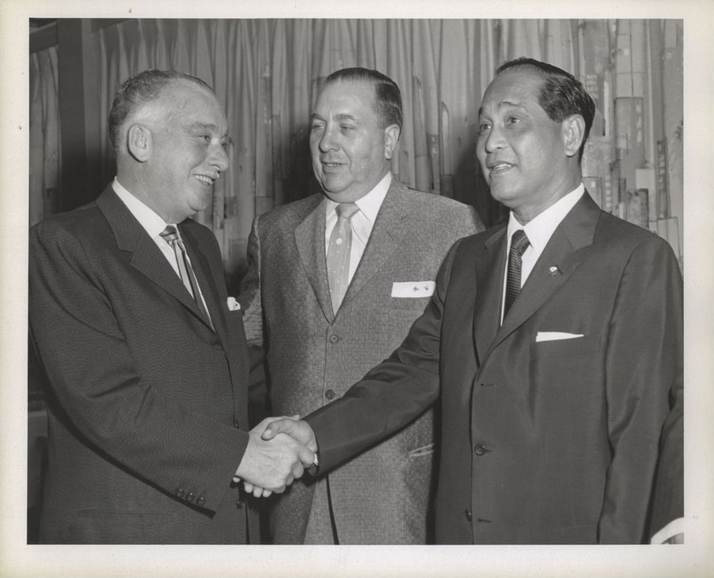 Miniature of Richard J. Daley with two men shaking hands