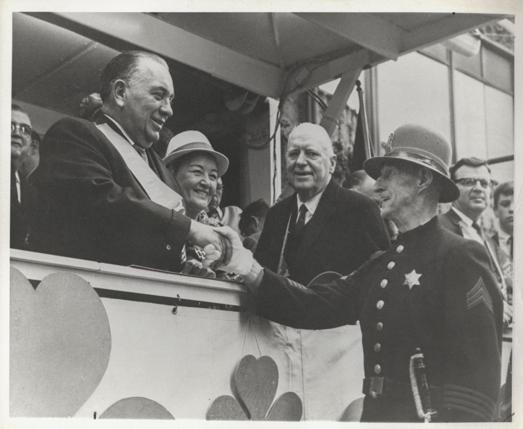 St. Patrick's Day Parade reviewing stand, Richard J. Daley shakes hands