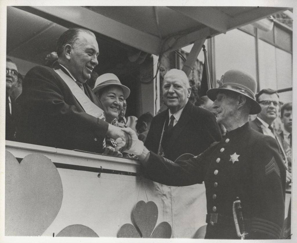 St. Patrick's Day Parade reviewing stand, Richard J. Daley shakes hands
