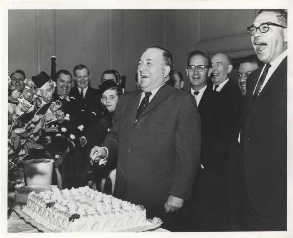 Miniature of Richard J. Daley cuts a cake at an anniversary celebration