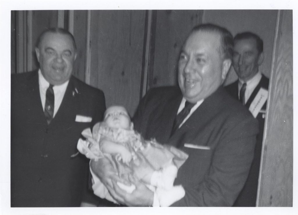 Miniature of Richard J. Daley holding a baby