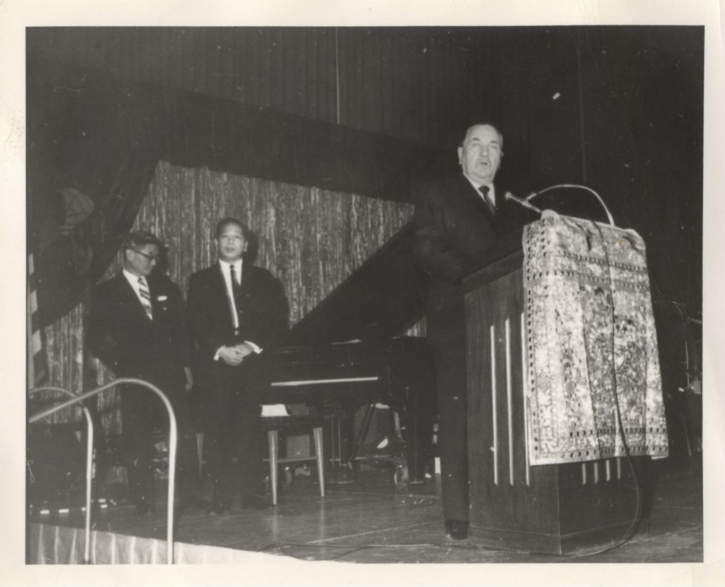 Richard J. Daley speaking at a music event