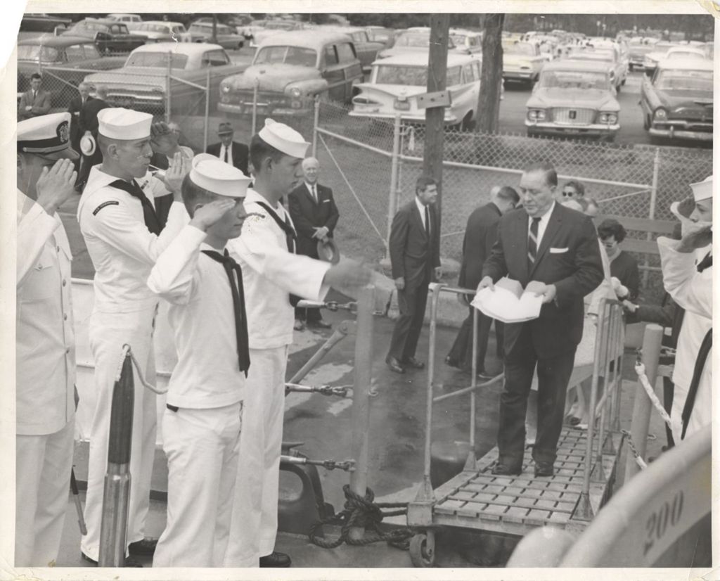 Richard J. Daley saluted as he boards a naval ship