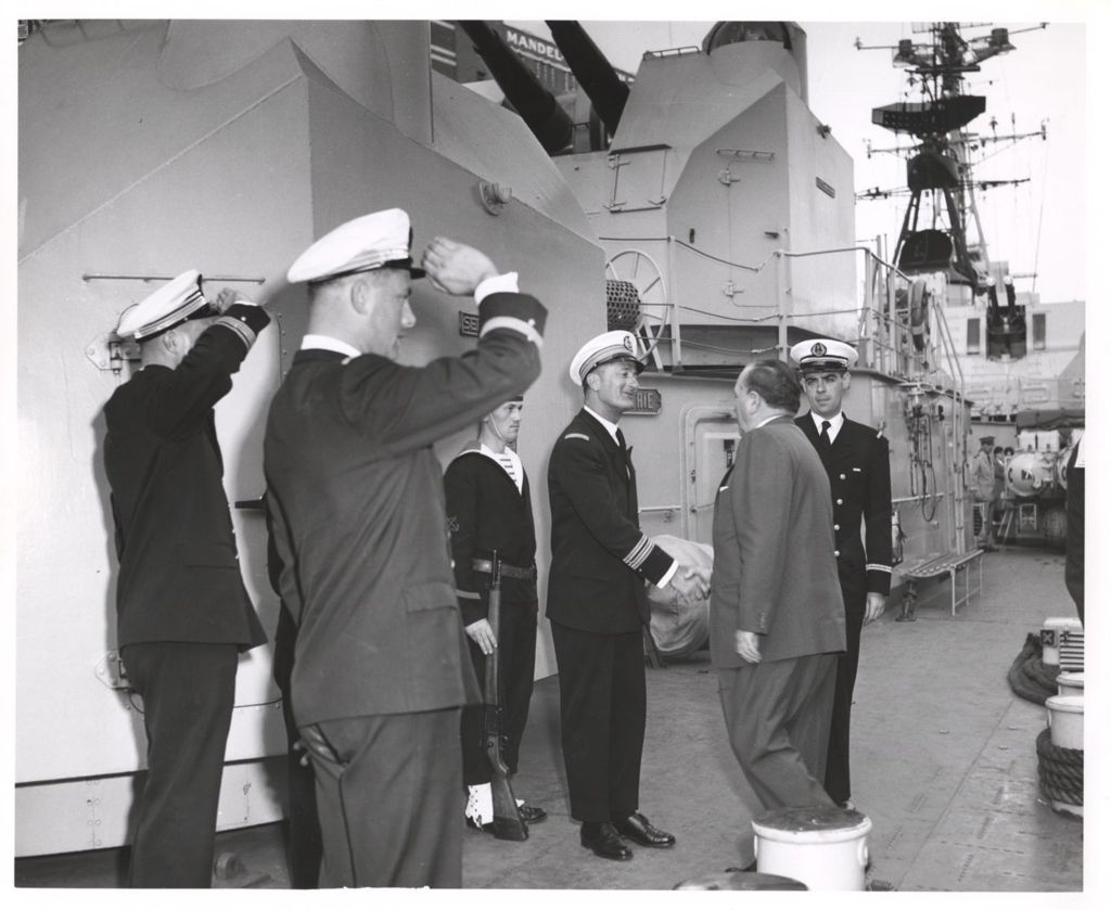 Miniature of Richard J. Daley greets the captain of a warship