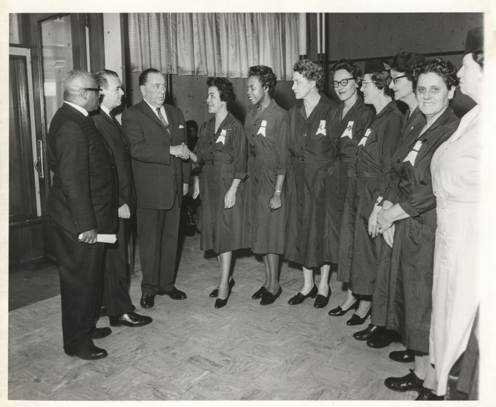 Richard J. Daley greets a group of women in uniform
