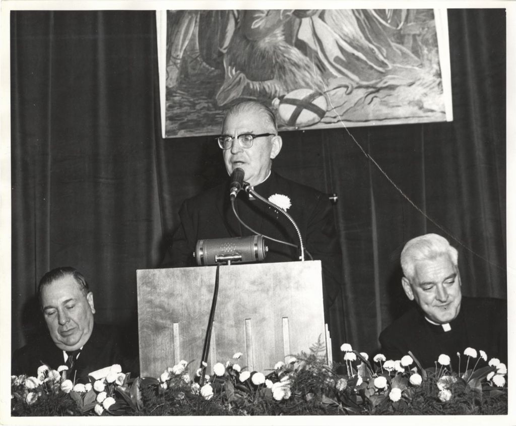 Miniature of Monsignor Cunningham speaking at an event