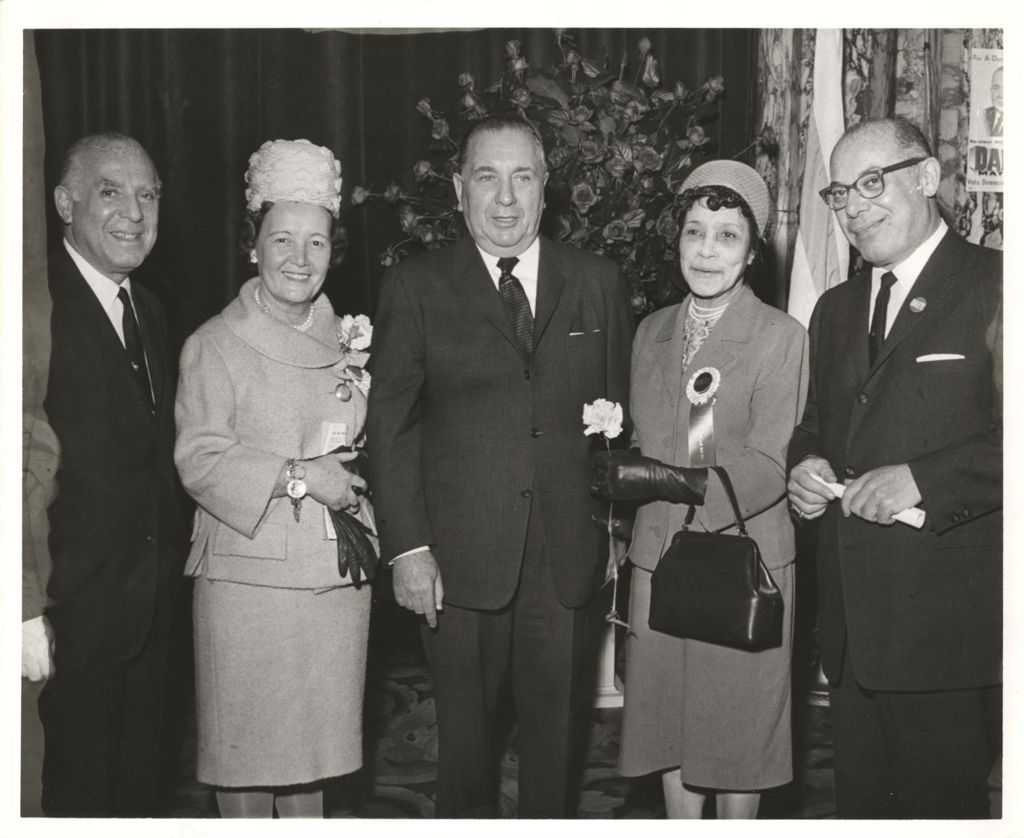Miniature of Richard J. and Eleanor Daley with a volunteer and others