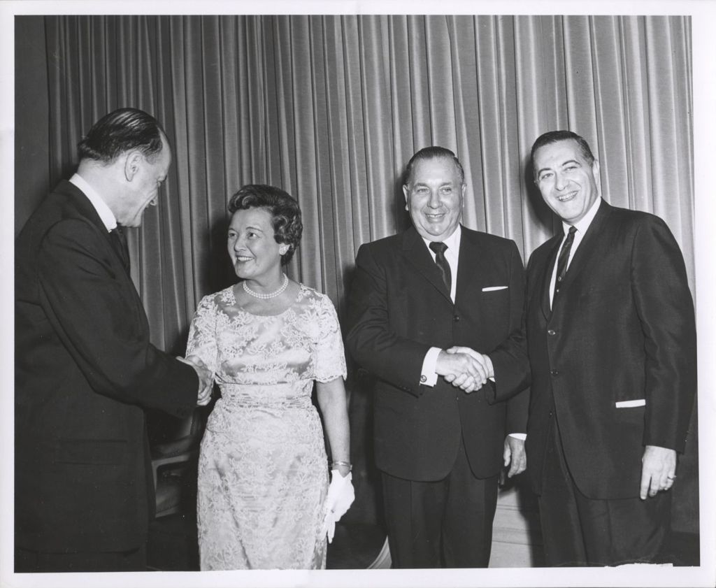 Richard J. and Eleanor Daley greeting two men