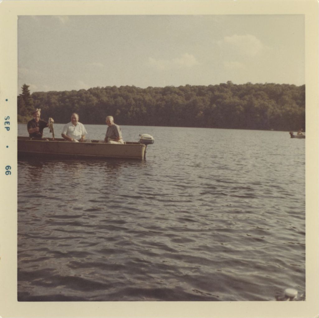 Norman Mayo, Richard J. Daley, and Leo Sheridan fishing on a lake