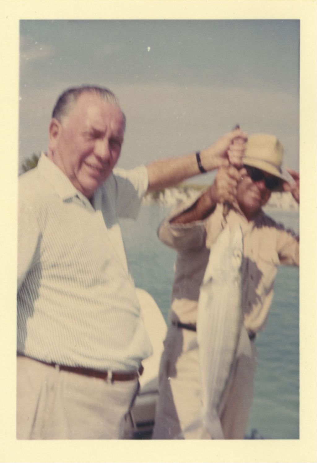 Miniature of Richard J. Daley and a man displaying their catch