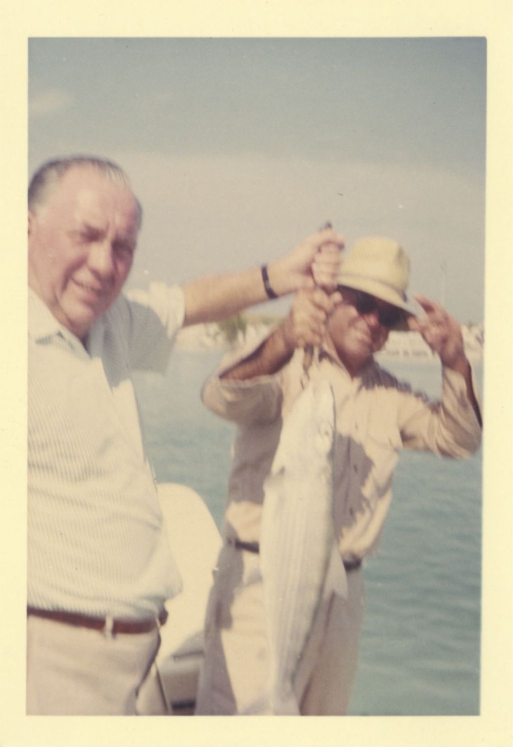 Richard J. Daley and a man displaying their catch