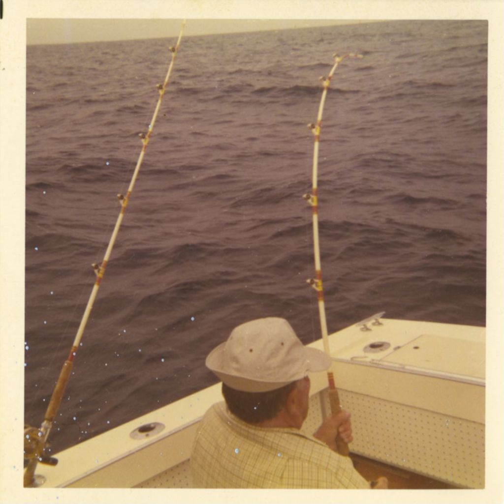 Richard J. Daley fishing from a boat