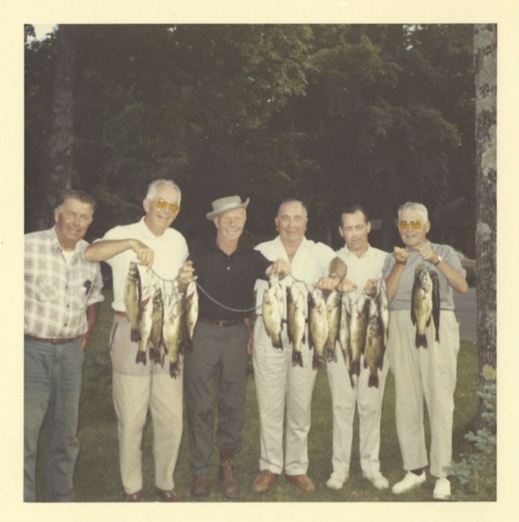 Miniature of Richard J. Daley and others display their catch of fish