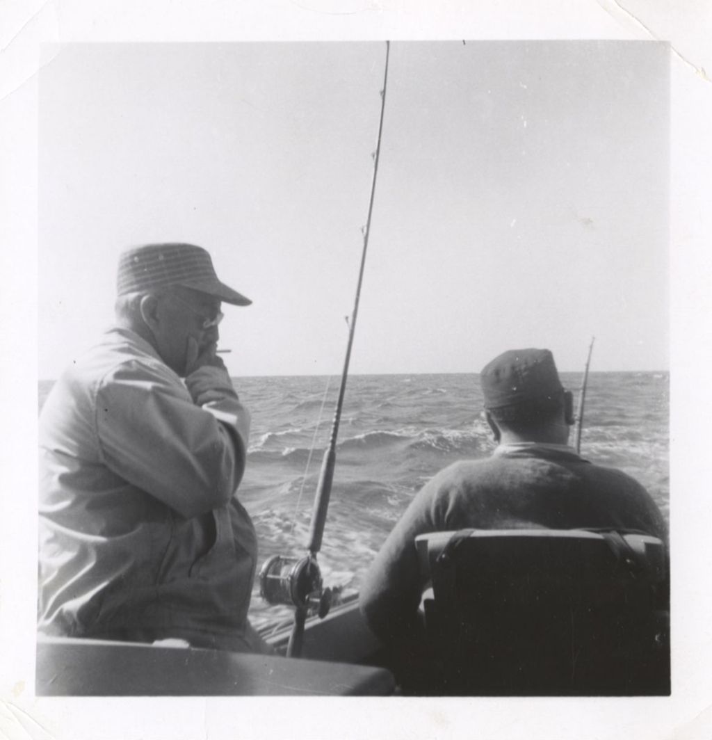 Senator Lynch and Richard J. Daley fishing from a boat