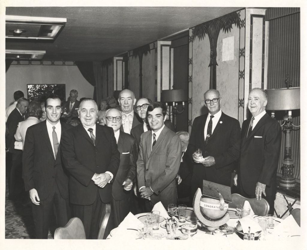 Miniature of Richard J. Daley with two of his sons and others at a graduation meal