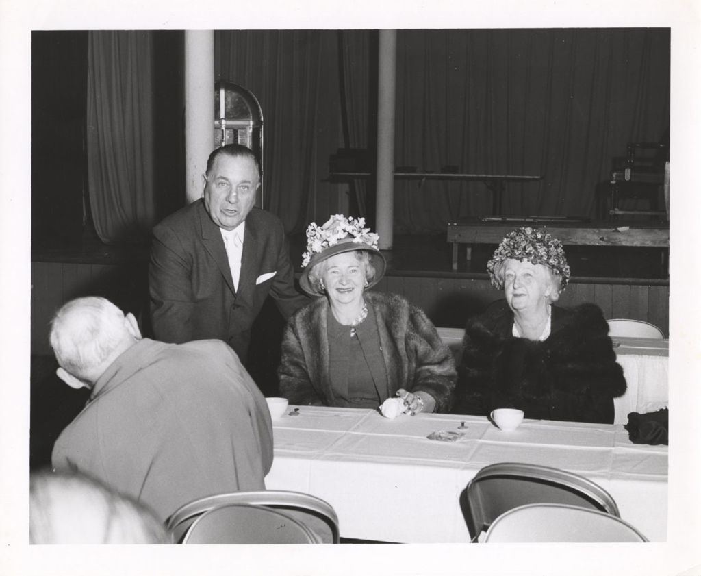 Richard J. Daley and two women at a dining event