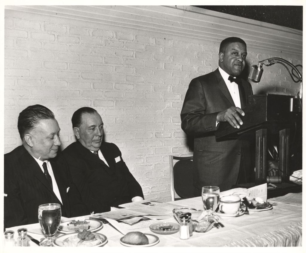 Richard J. Daley listening to a speaker at a banquet