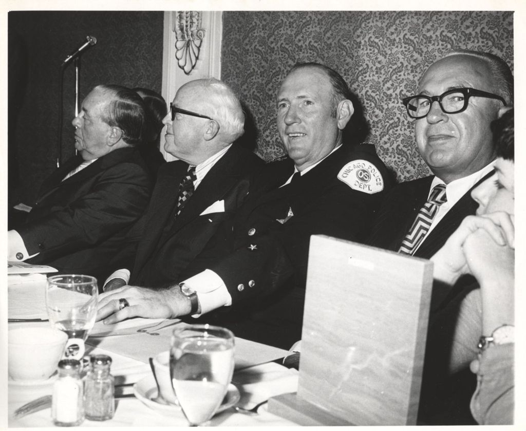 Miniature of Richard J. Daley and others at banquet table