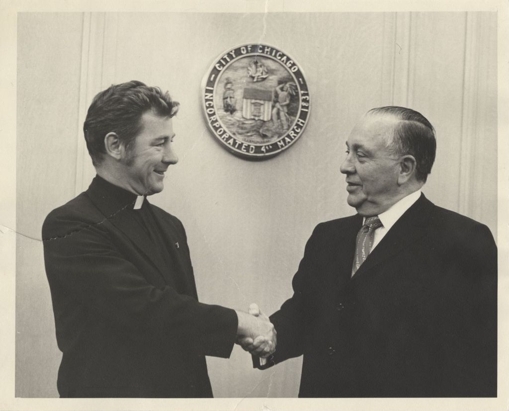 Miniature of Richard J. Daley and Father Cusak shaking hands