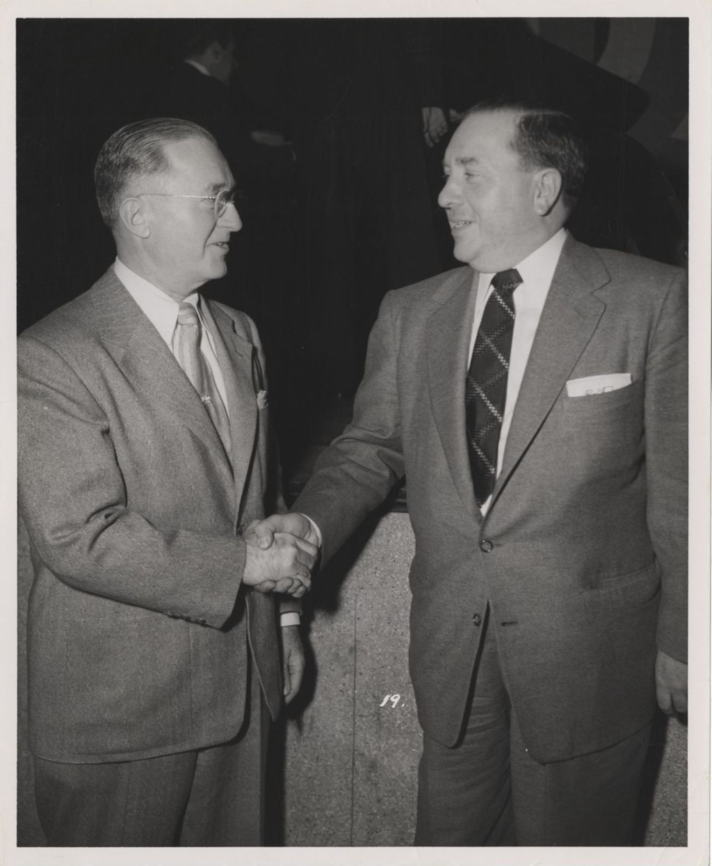 Richard J. Daley shaking hands with Dr. Karl A. Meyer