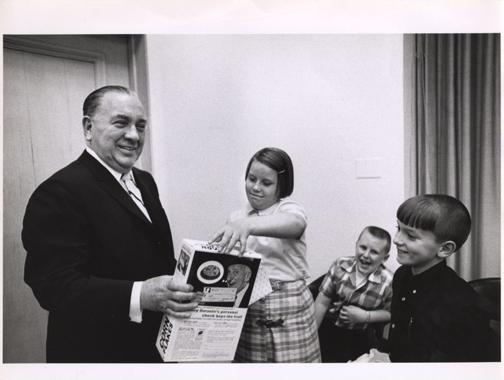 Miniature of Richard J. Daley with children and box of cereal