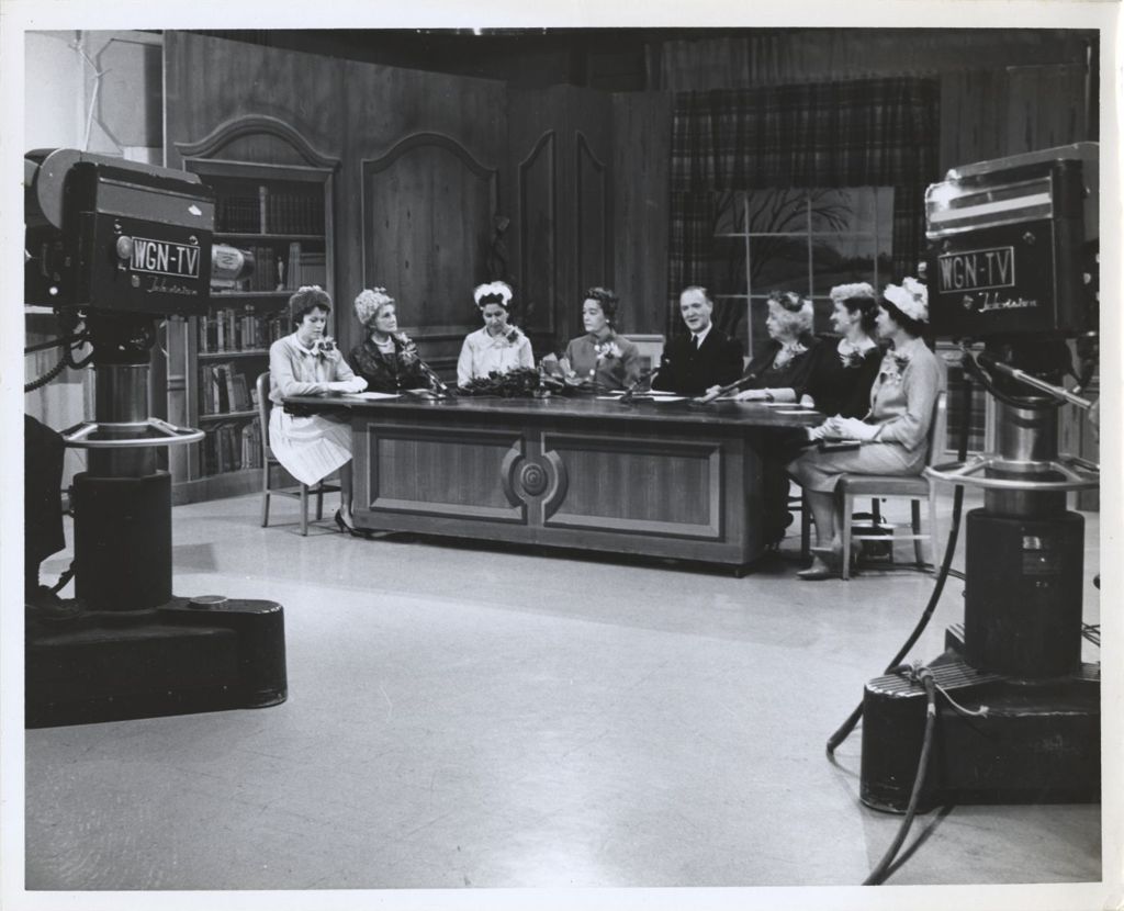 Miniature of Eleanor Daley moderating a television talk show