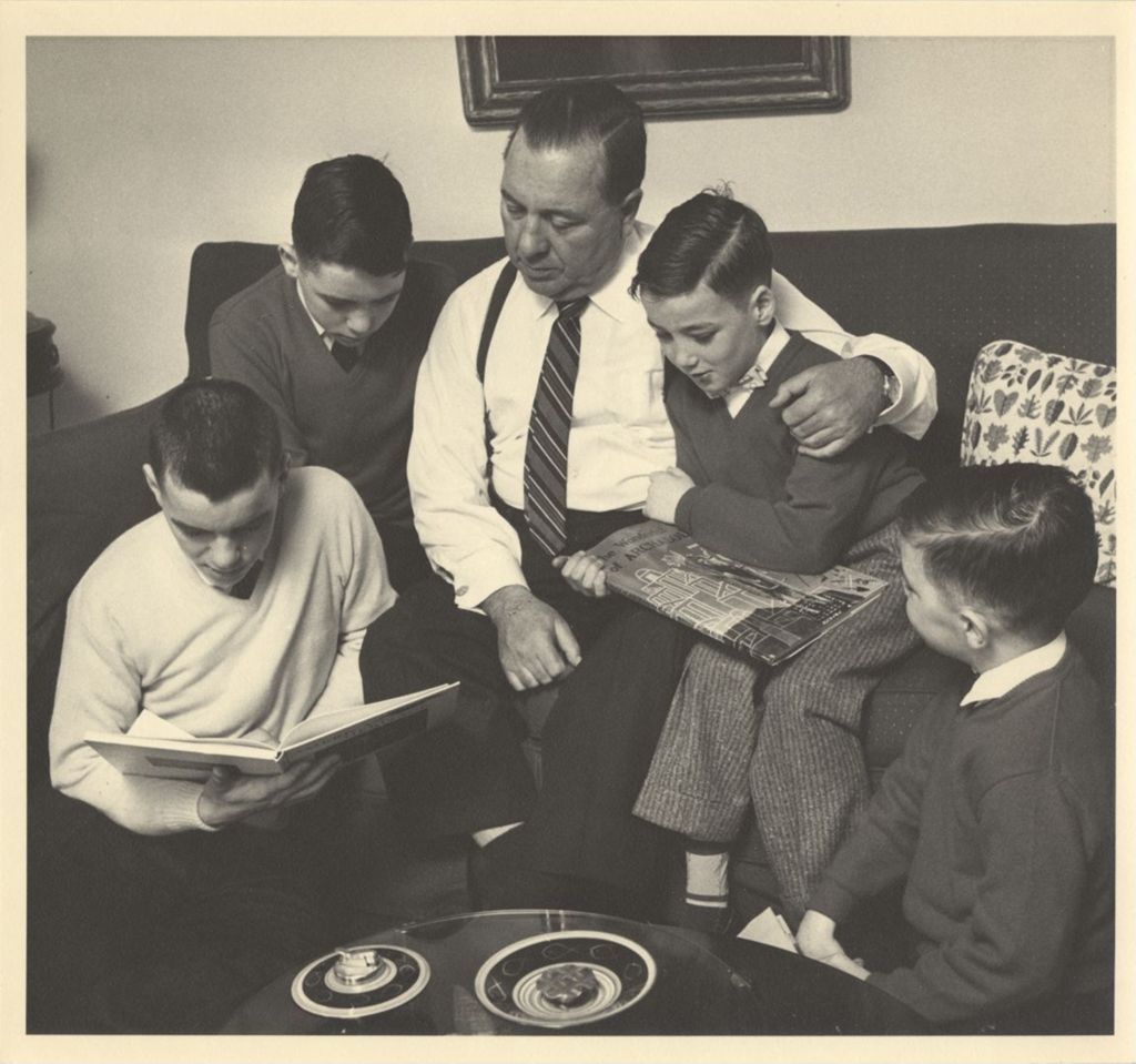 Miniature of Richard J. Daley reading with his sons