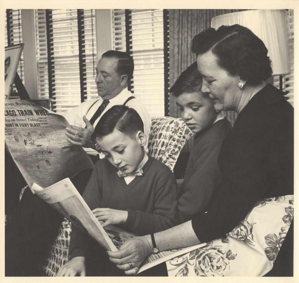 Daley family reading the newspaper