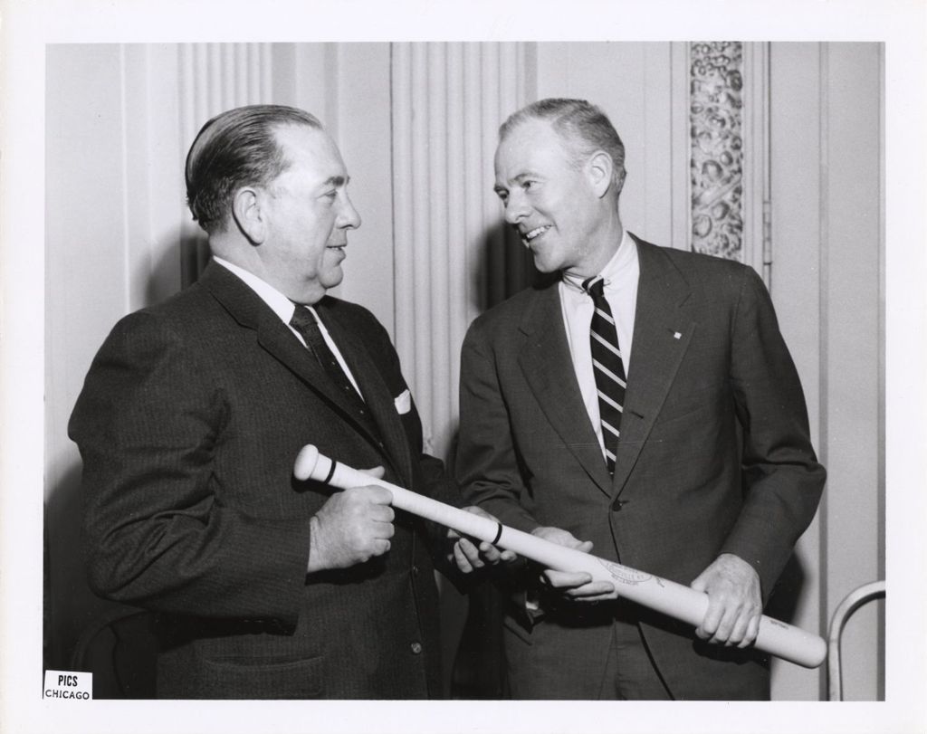 Richard J. Daley receiving baseball bat