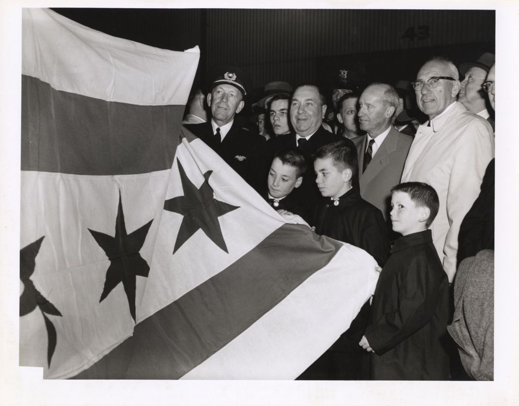 Richard J. Daley and his sons with a Chicago flag